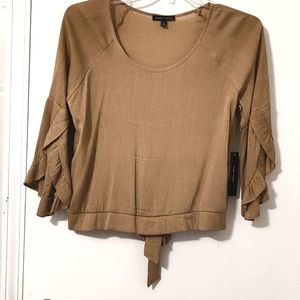 Fun top with flutter sleeves and bow in back